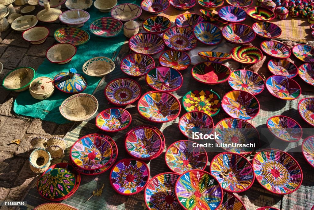 Aksum, Ethiopia - December 29, 2018: Beautifully colored handmade cloth plates and bowls, exhibited at a street market in Aksum, Ethiopia.